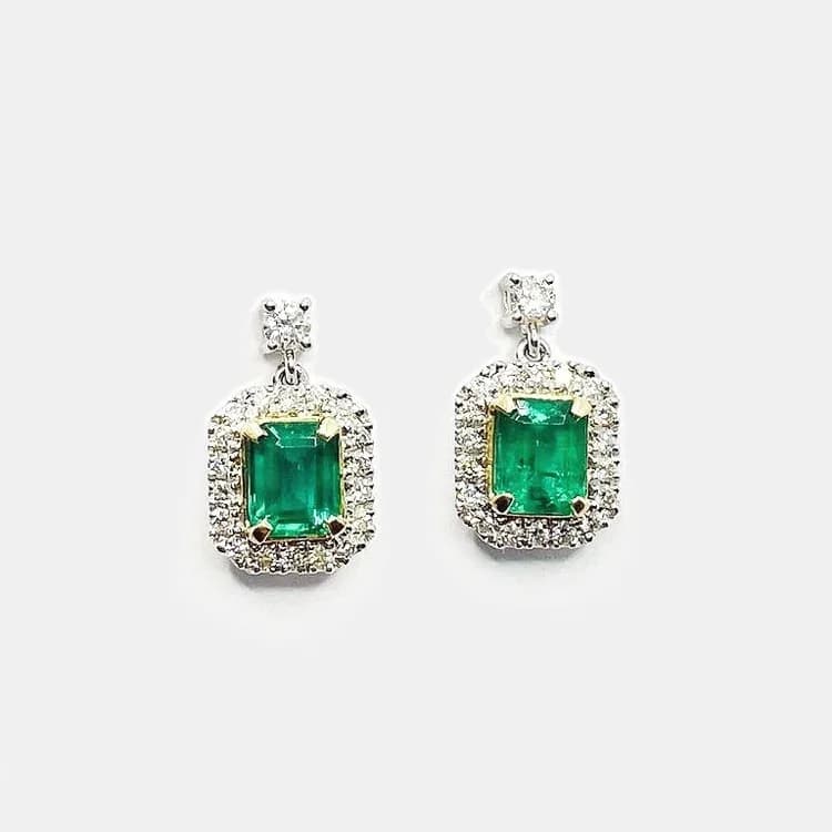 Emerald drop earrings product photo on a studio background, by ImagePipeline